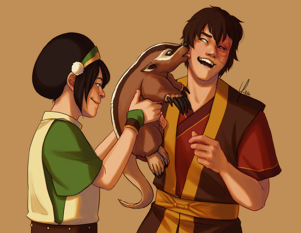 Toph stands holding a baby badgermole up to Zuko. It is licking his face, making him laugh.